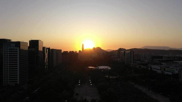 Santiago City Skyline at Sunset. Aerial View. Las Condes Commune. Chile. Drone Flies Upwards