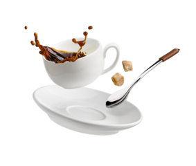 Cup of coffee with a splash drop fly with saucer and spoon on white