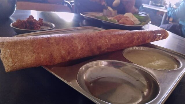 A closeup of the south Indian dish masala dosa served on a plate