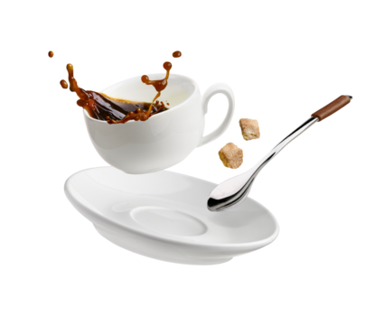 Cup of coffee with a splash drop fly with saucer and spoon on white
