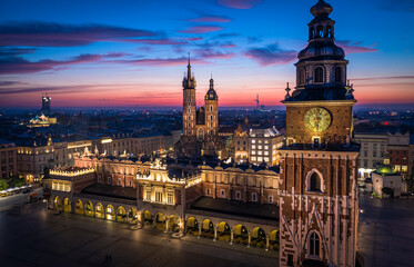 Panorama of Main Square (Saint Mary's Basilica, Sukiennice - Town Hall, Town Hall Tower) in Krakow during magic dawn, Poland