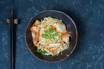 Egg noodle with barbecued red pork and wonton serving with soup and sweet sauce - Thai tasty street food