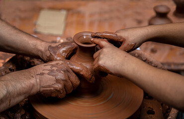 hands of a potter at work
