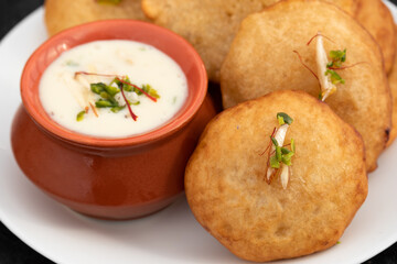 Traditional Indian Malpua, Pua Or Pooa Served With Lachhedar Malai Rabri Also Called Khurchan Rabdi, Lachha Rabidi Is Widely Enjoyed On Festival Like Holi, Diwali