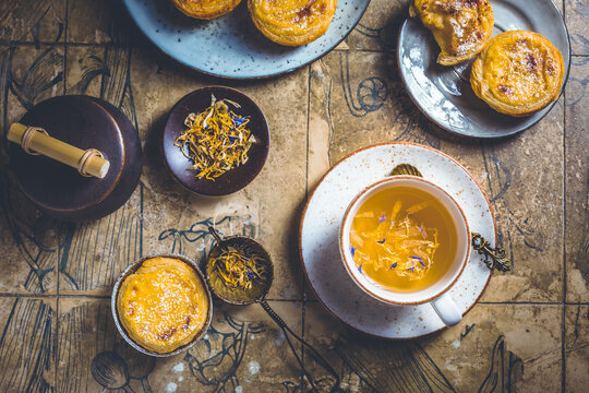 Pastel de nata with cup of herbal tea, Portugal sweet egg and pudding pastry