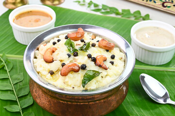 Ven Pongal famous south indian breakfast served in banana leaf.