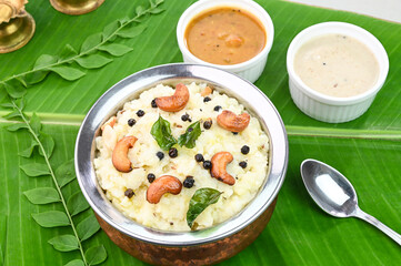 Ven Pongal famous south indian breakfast served in banana leaf.