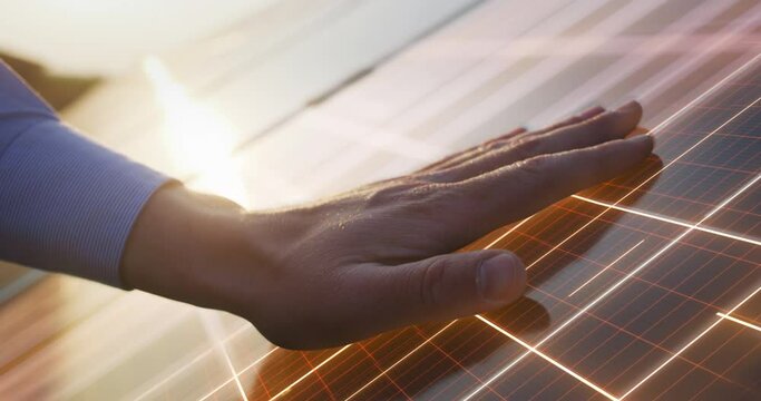 Close Up on Hand Of Professional Maintenance Engineer Touching Industrial Solar Panel Generating Electricity. VFX Graphics Animation Visualizing Energy Being Generated. Green Energy Concept.
