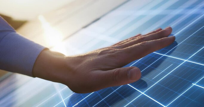 Close Up on Hand Of Professional Maintenance Engineer Touching Industrial Solar Panel Generating Electricity. VFX Graphics Animation Visualizing Energy Being Generated. Sustainable Energy Concept.