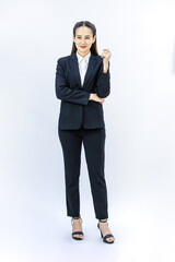 Portrait isolated cutout studio full body shot of Millennial Asian professional successful female businesswoman lawyer ceo in formal business suit holding hands crossed arms on white background