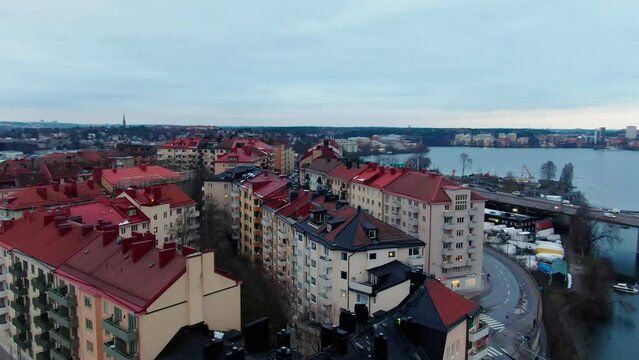 Urban area on island Stora Essingen in Stockholm Sweden in orbiting drone shot