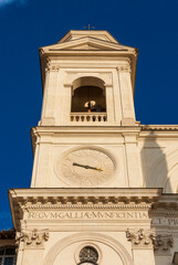 Fototapeta premium Religious architecture in Rome.Twin bell tower with clock of Trinità dei Monti renaissance church, at the top of famous Spanish Steps