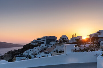 Santorini sunset. One of the top summer destinations in the world. The city of Oia and its white...