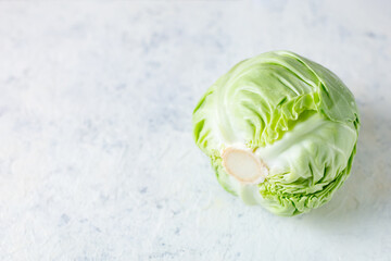 Fresh raw whole cabbage on white table. Organic healthy food. Top view with copy space