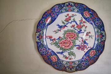 Antique oriental blue red and white plate with birds and peonies