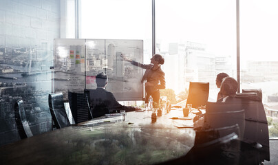Their company is taking the city by storm. Multiple exposure shot of businesspeople in a meeting...