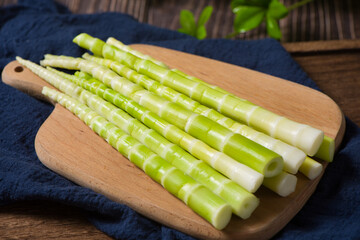 Peeled green bamboo shoots  on table