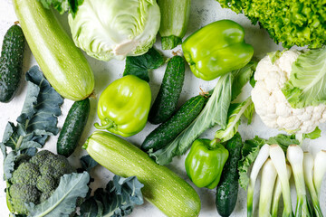 Variety of green vegetables background. Top view of healthy organic food