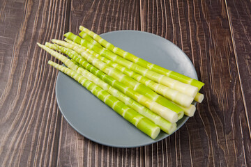 Peeled bamboo shoots in plate on table