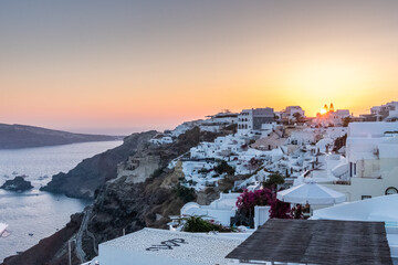 Santorini sunset. One of the top summer destinations in the world. The city of Oia and its white...