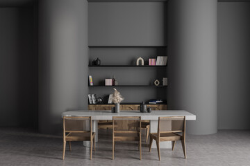 Gray dining room interior with bookcase
