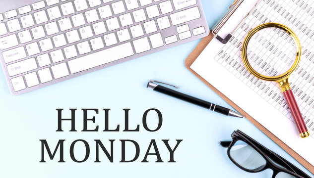 HELLO MONDAY text on blue background with keyboard and clipboard, business concept