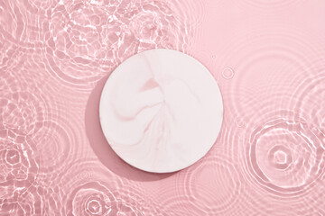 Marble pink round podium or stand top view flat lay product display minimal, simple pastel pink...