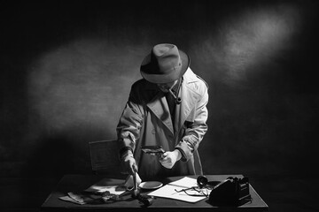 Black and white, noir photography. Man, professional detective in hat, smoking pipe and looking on...