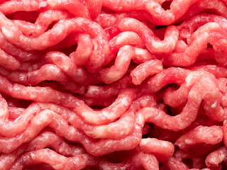 Minced meat on a cutting board. Top view, close-up