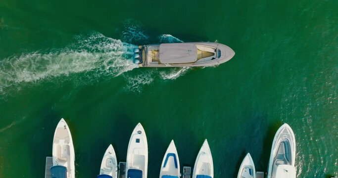 Top down Drone shot of a boat exit the parking, marina, Colombia, Cartagena
