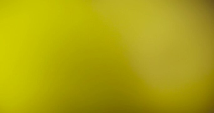 Abstract spotted yellow background, abstract background not focused on yellow objects