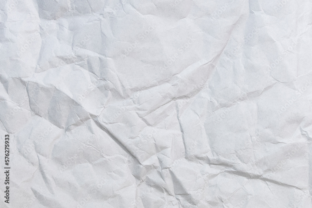 Wall mural crumbled paper top view close-up of crumpled sheet of white paper. top view textured paper backgroun