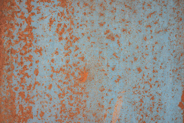 Texture of a rusty blue-red background. A grungy, vintage background with copy space.