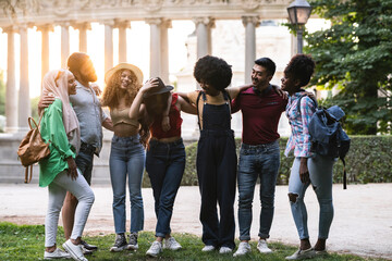 Fototapeta premium group of diverse people travelers, backpackers in the new city are walking around the city