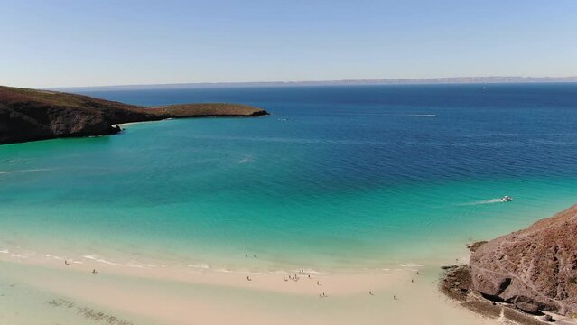 High aerial over beautiful turquoise water in Balandra Bay in Baja Sur, Mexico at low tide