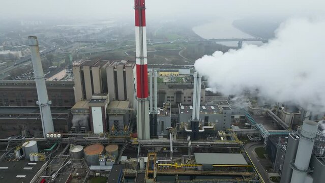 Environmental issues, energy extraction from coal, termal power station, view from height of the pipes in the smog, aerial view.
