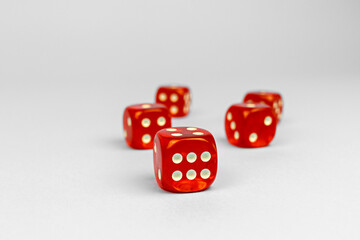 Red dice for boarding games on a white background.