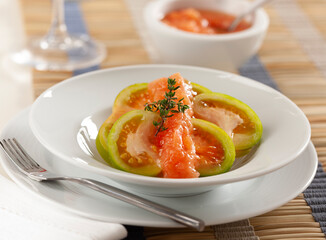 Green tomatoes cut and seasoned with tomato sauce