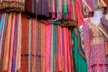 Fototapeta na wymiar typical moroccan clothes on display in a shop in a souk in marrakech.