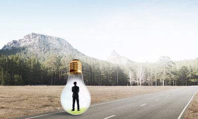 Businessman inside light bulb