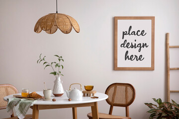 Creative composition of dining room interior witch mock up poster, round table, rattan chair and personal accessories. Template.