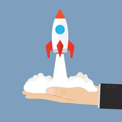 Big businessman hand helping launch spaceship. Entrepreneur and startup project, start new business or opportunity to invent new product, innovation technology, ambition to success concept.