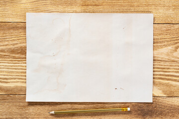 Sheet of paper lying on wooden table