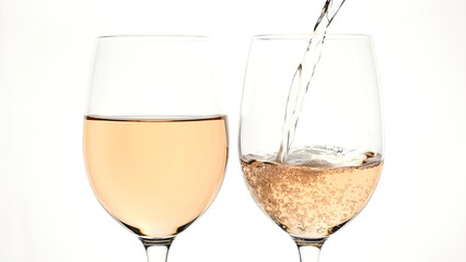 Pouring rose wine into glass from the bottle on the white background
