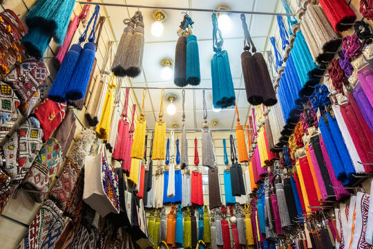 colorful typical curtain tassels hanging in a shop in a souk in marrakech