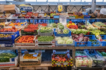 Colorful and fresh fruits and vegetables on a balcony of a regional market