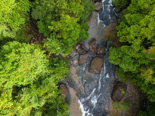 Fototapeta na wymiar Asian jungle and Khlong Chao waterfall on Koh Kood island. Thailand