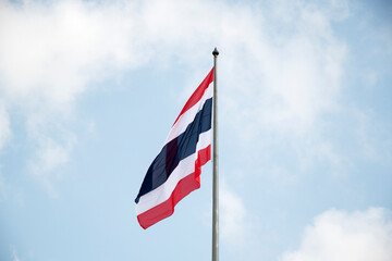 Thailand flag waving in wind with blue sky
