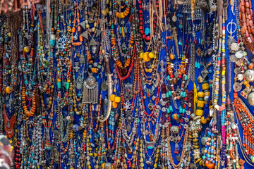 Necklaces and jewels of colored stones in a shop in a souk in the Medina in Marrakech