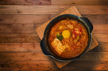 Korean soup call ‘Kimchi Jjigae’ or Kimchi Soup with Tofu and york Egg